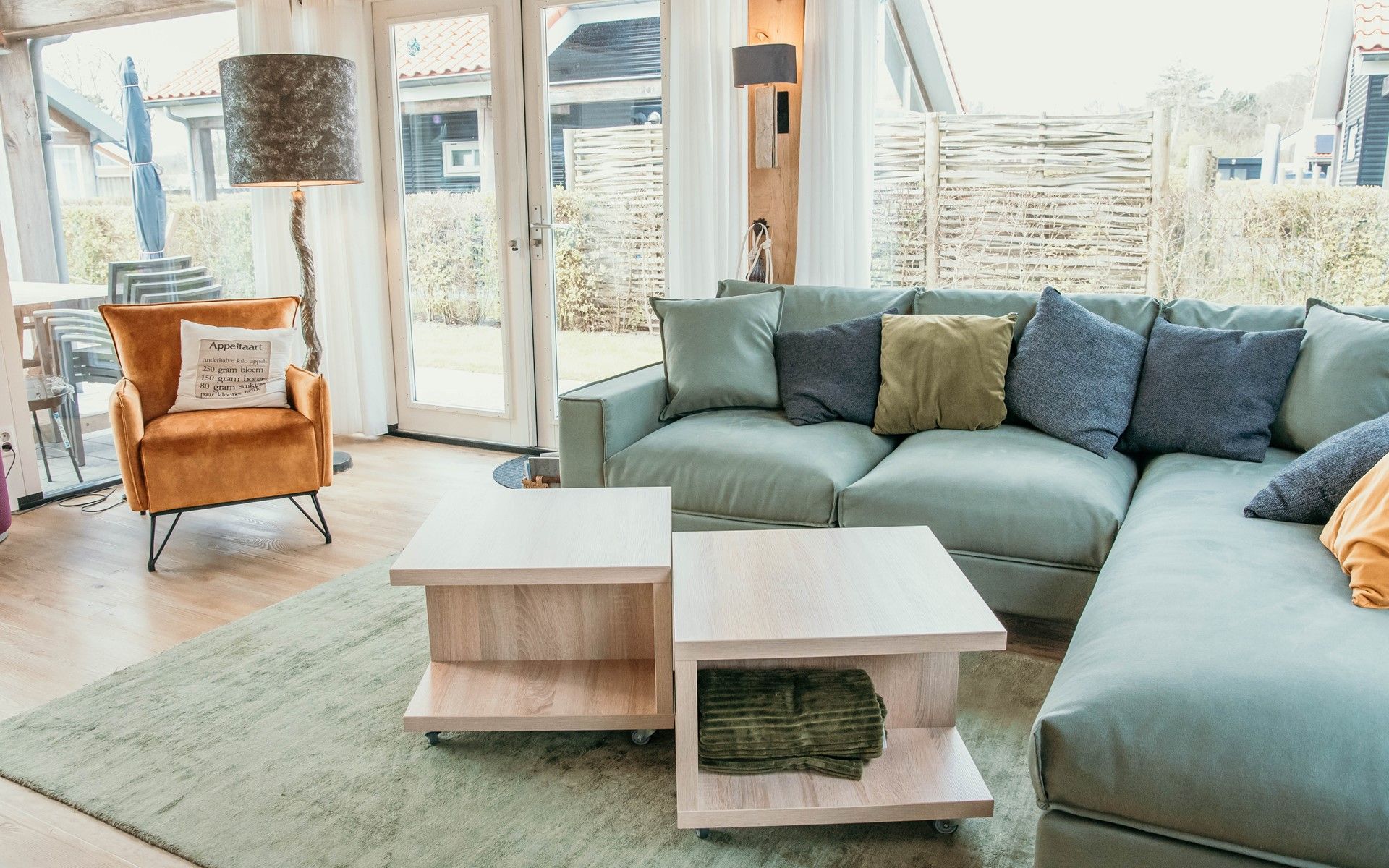 Bright living room of Mon Repos in Renesse with comfortable sofa and modern furnishings