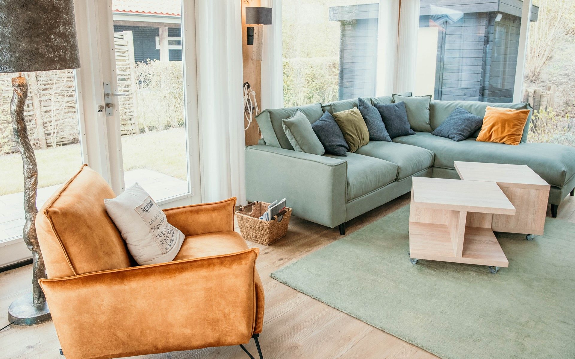 Stylish living room in Mon Repos, Renesse with modern furniture and lots of natural light