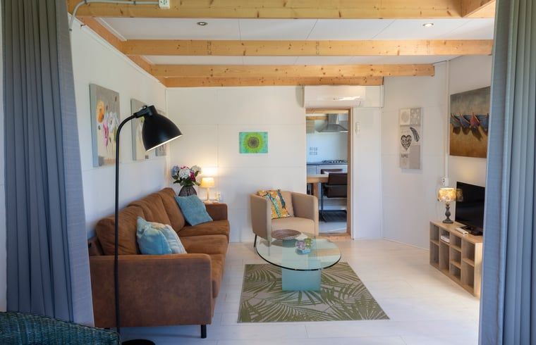 Stylish living room of Huisje in Renesse, a vacation home in Renesse surrounded by nature.