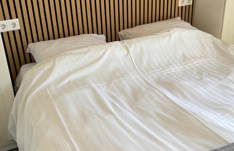 Knusse slaapkamer in Huisje in Koudekerke, vakantieaccommodatie in Zeeland.