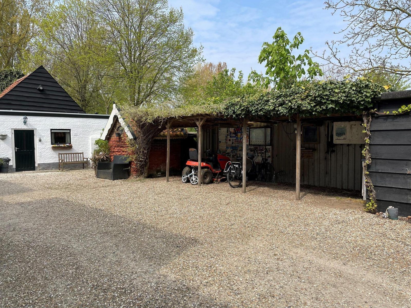 Bicycle storage at VZ034 Apartment Koudekerke, vacation home in Koudekerke, Walcheren, with covered space.