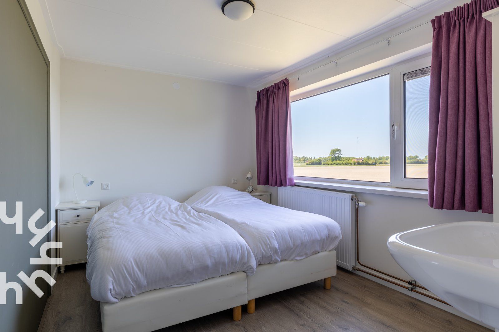 Gemuetliche Sitzecke im Ferienhaus ZE142 in Koudekerke, Walcheren mit Blick auf den Garten.