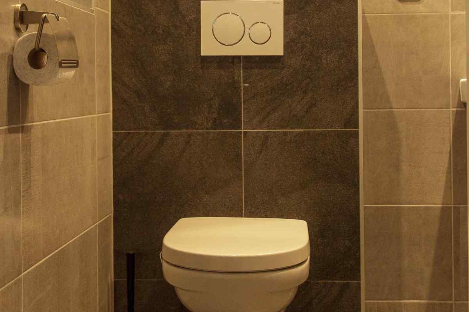 Gemuetliche Sitzecke im Ferienhaus ZE320 in Oostkapelle, Walcheren, mit viel Tageslicht.