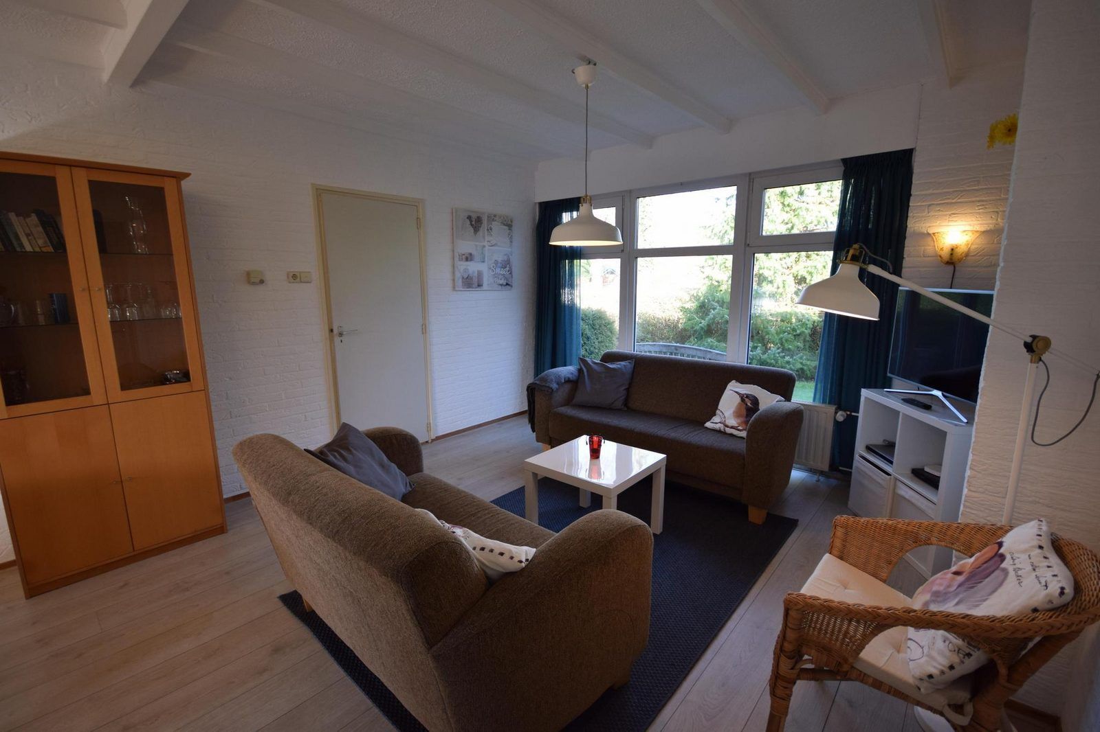 Cozy living room of VZ1163 Holiday bungalow in Oostkapelle, Walcheren, Zeeland with comfortable sofas.