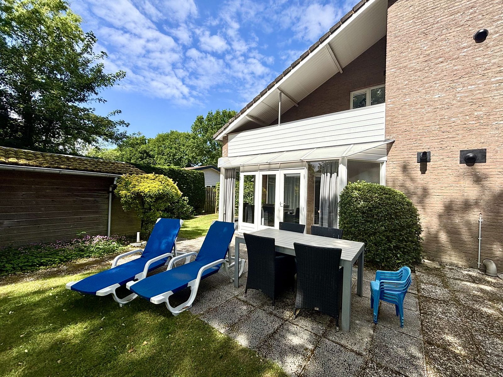Terrace with deck chairs and table at Apartment Boszicht 1, Oostkapelle, Walcheren.