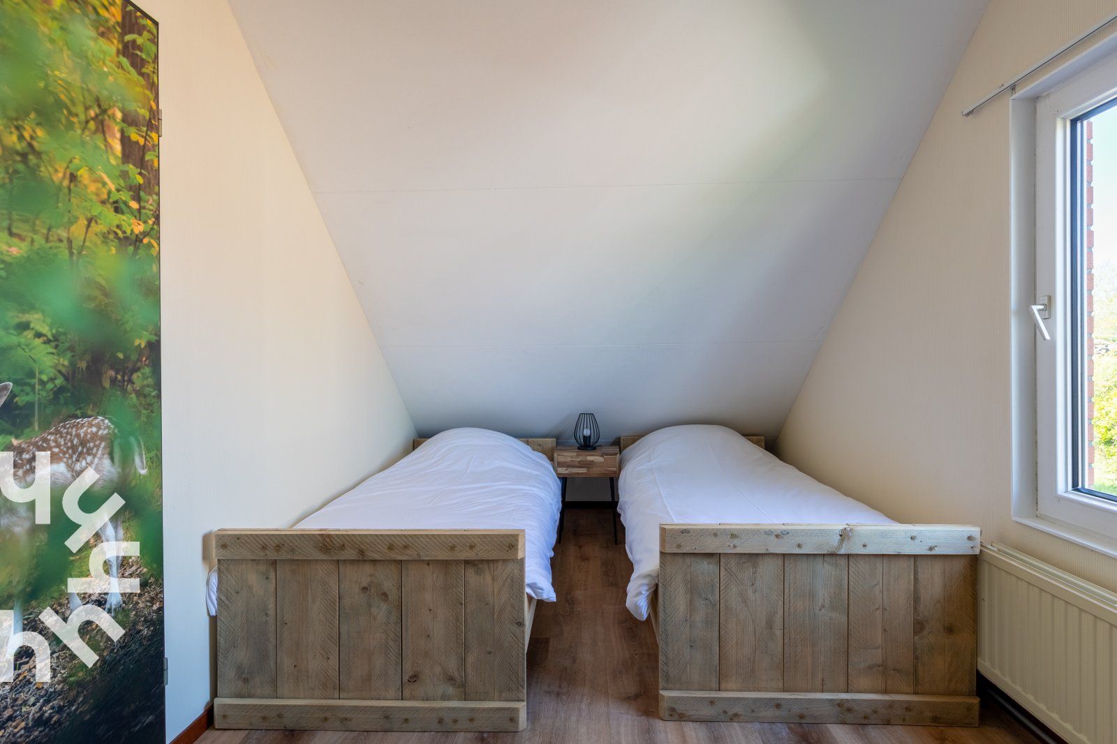 Bright bedroom with large windows in vacation home ZE414, Oostkapelle, Walcheren, Zeeland.