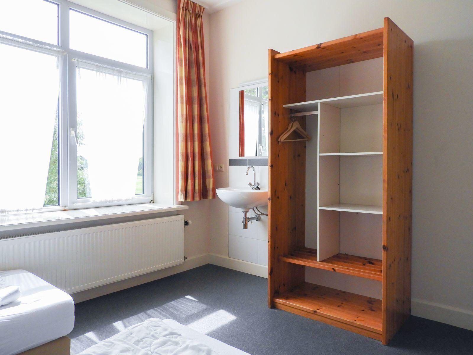 Bedroom with view in VZ131 Group accommodation Westkapelle, vacation home in Westkapelle, Walcheren.