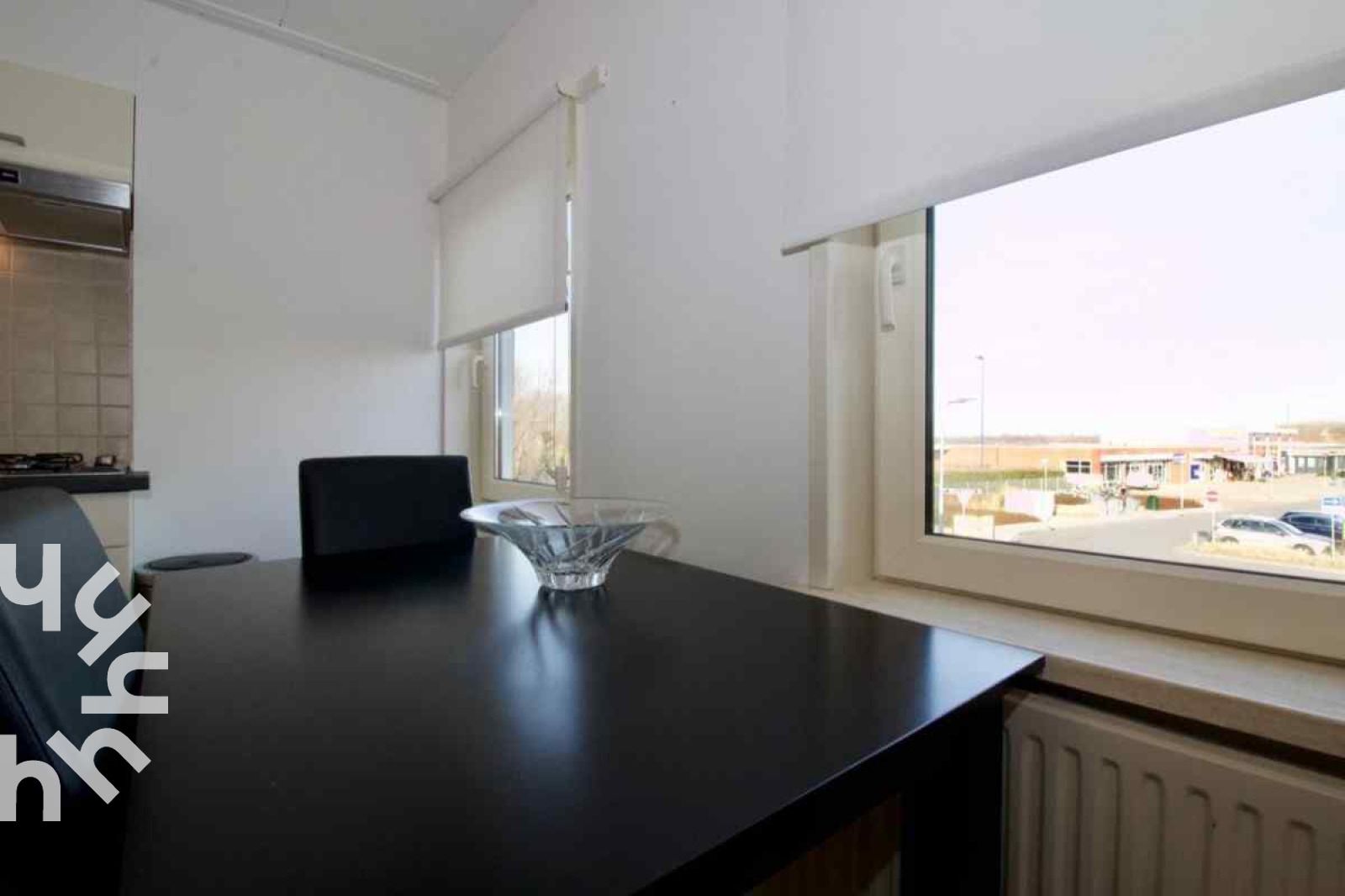 Cozy living room in vacation home ZE303, Zoutelande, Walcheren, with television and sitting area.