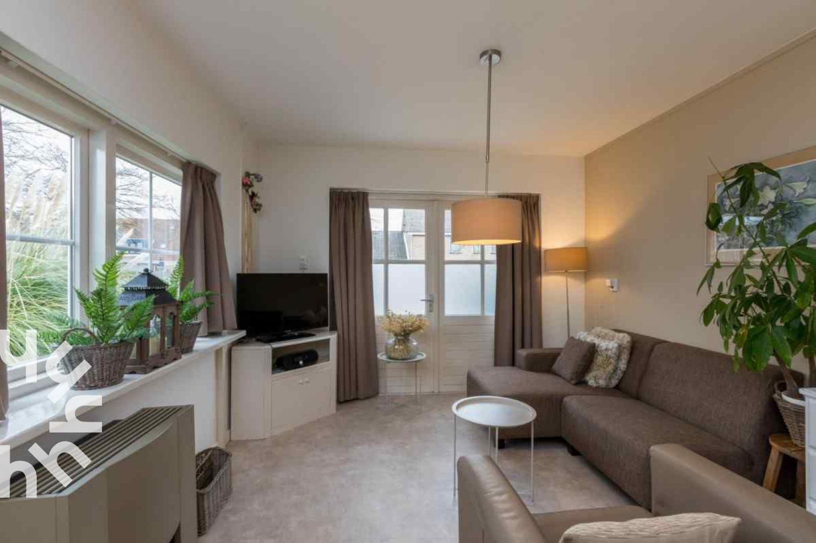 Living room with modern furnishing in vacation home ZE1392, Zoutelande, Walcheren.