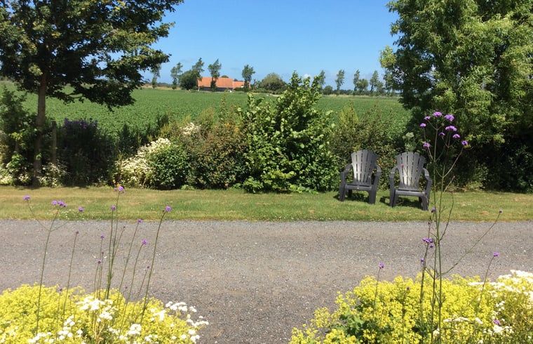 Restful view in the garden of Holiday home in Vrouwenpolder, Walcheren, Zeeland with seating.