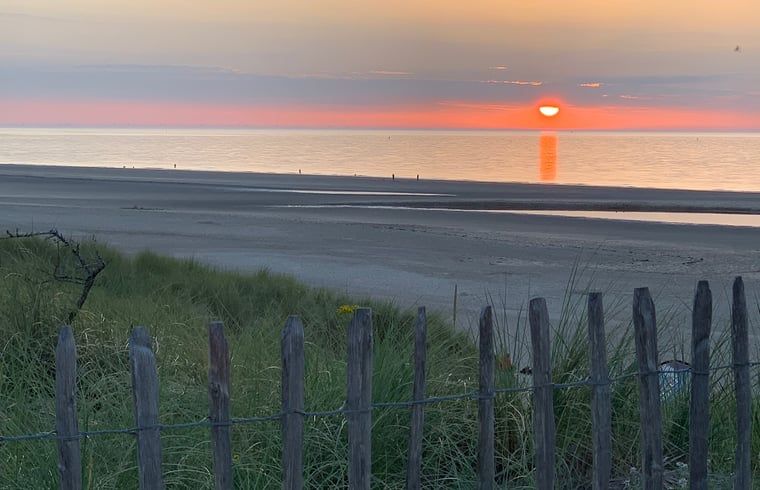 Breathtaking sunset at beach in Vrouwenpolder, Walcheren, Zeeland near Holiday Home.