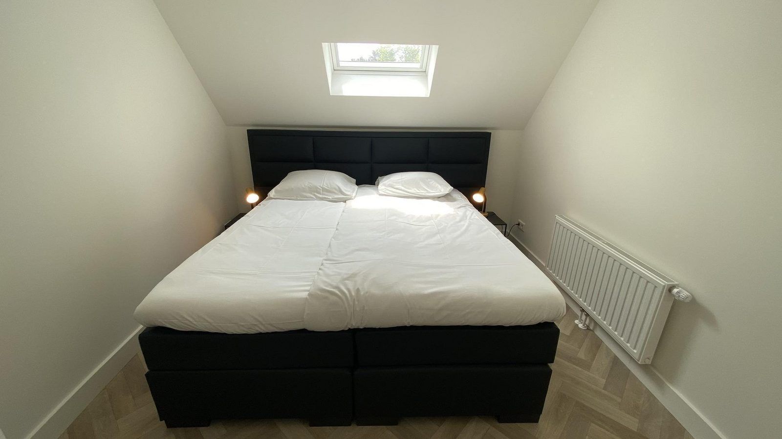 Comfortable bedroom in VZ1022 Holiday apartment in Veere, Walcheren, Zeeland with large bed.