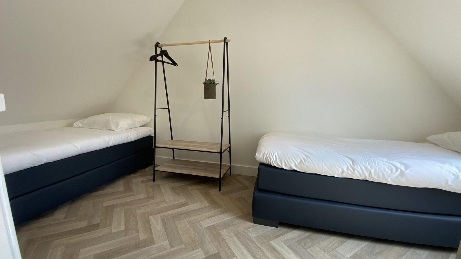 Spacious bedroom with two beds in VZ1022 Holiday apartment in Veere, Walcheren, Zeeland.