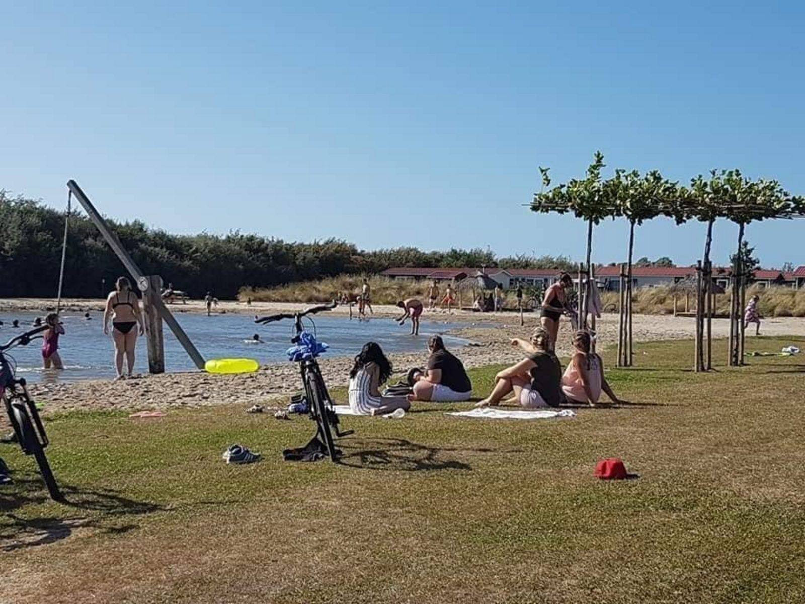 Sunny beach day at VZ824 Chalet in Veere, Serooskerke, Walcheren, with swimming and playing fun.