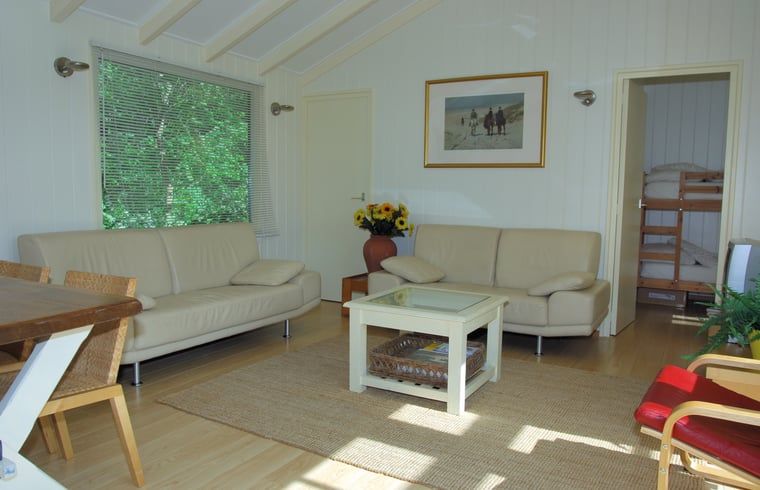 Bright living room of Holiday home in Dishoek, Walcheren, with comfortable sofas.