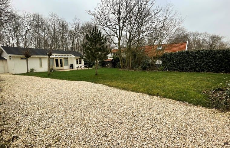 Spacious garden and driveway at Holiday home in Dishoek, Walcheren, ideal for families.