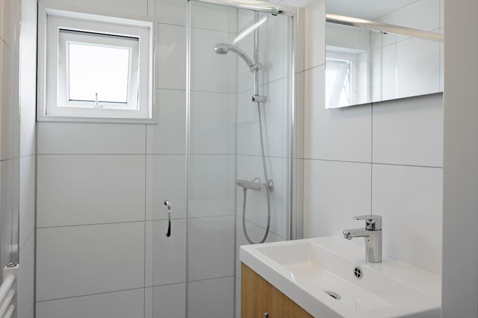 Enjoy the serene view from the terrace of Lodge 6C in Breskens, Zeeuws-Vlaanderen, an idyllic vacation home experience in Zeeland.