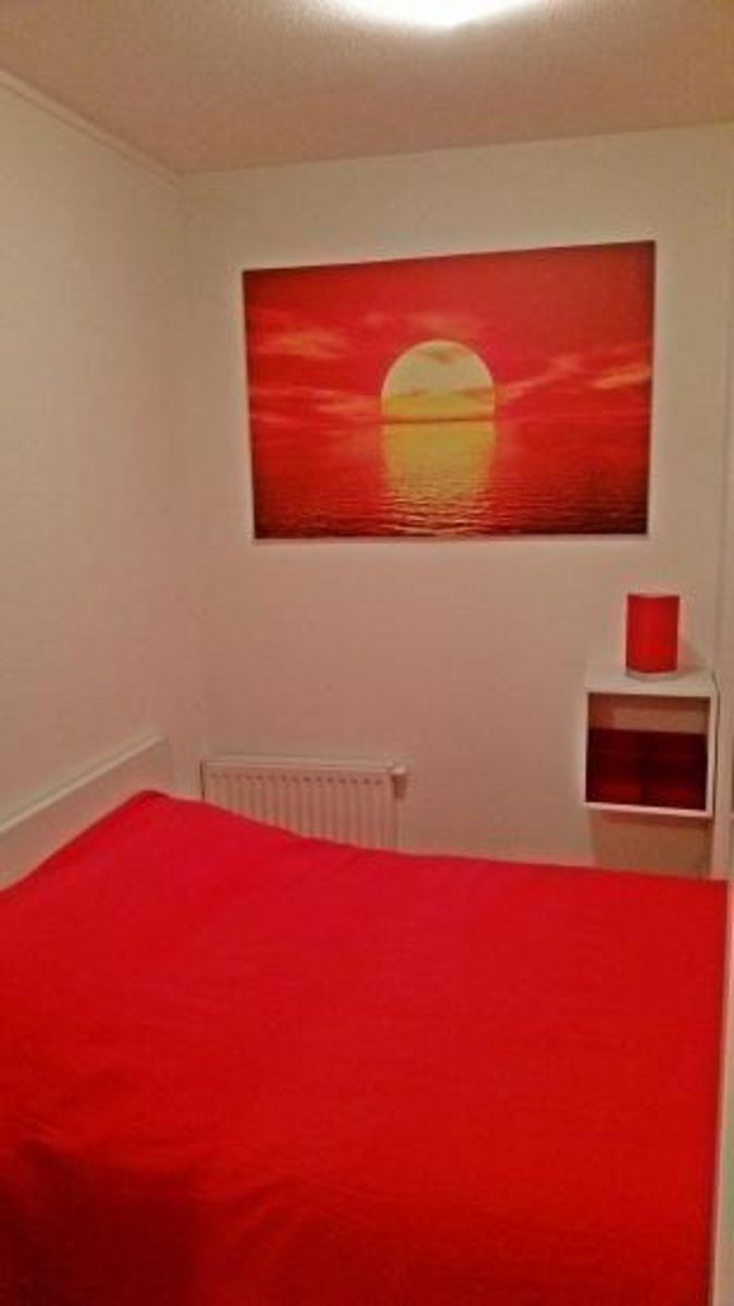 Gemuetliches Schlafzimmer mit warmen Farben in VZ571 Apartment Cadzand, Ferienunterkunft in Zeeuws-Vlaanderen.