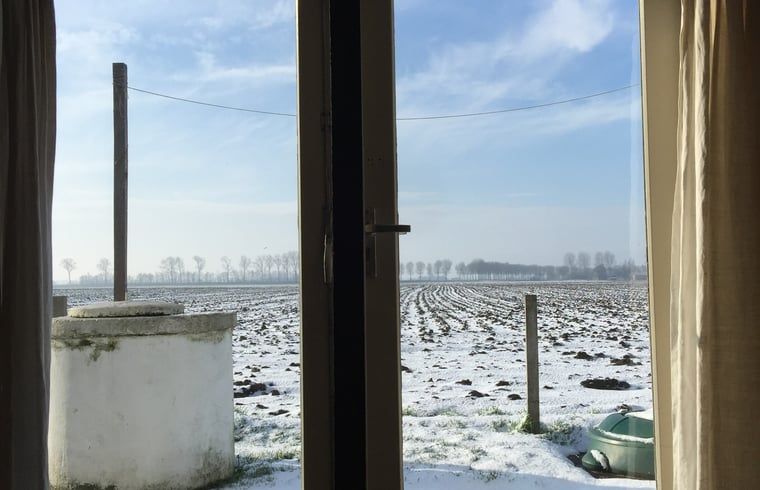Prachtige zonsondergang vanuit Vakantiehuis in Walsoorden, Zeeuws-Vlaanderen, met uitzicht op de natuur.