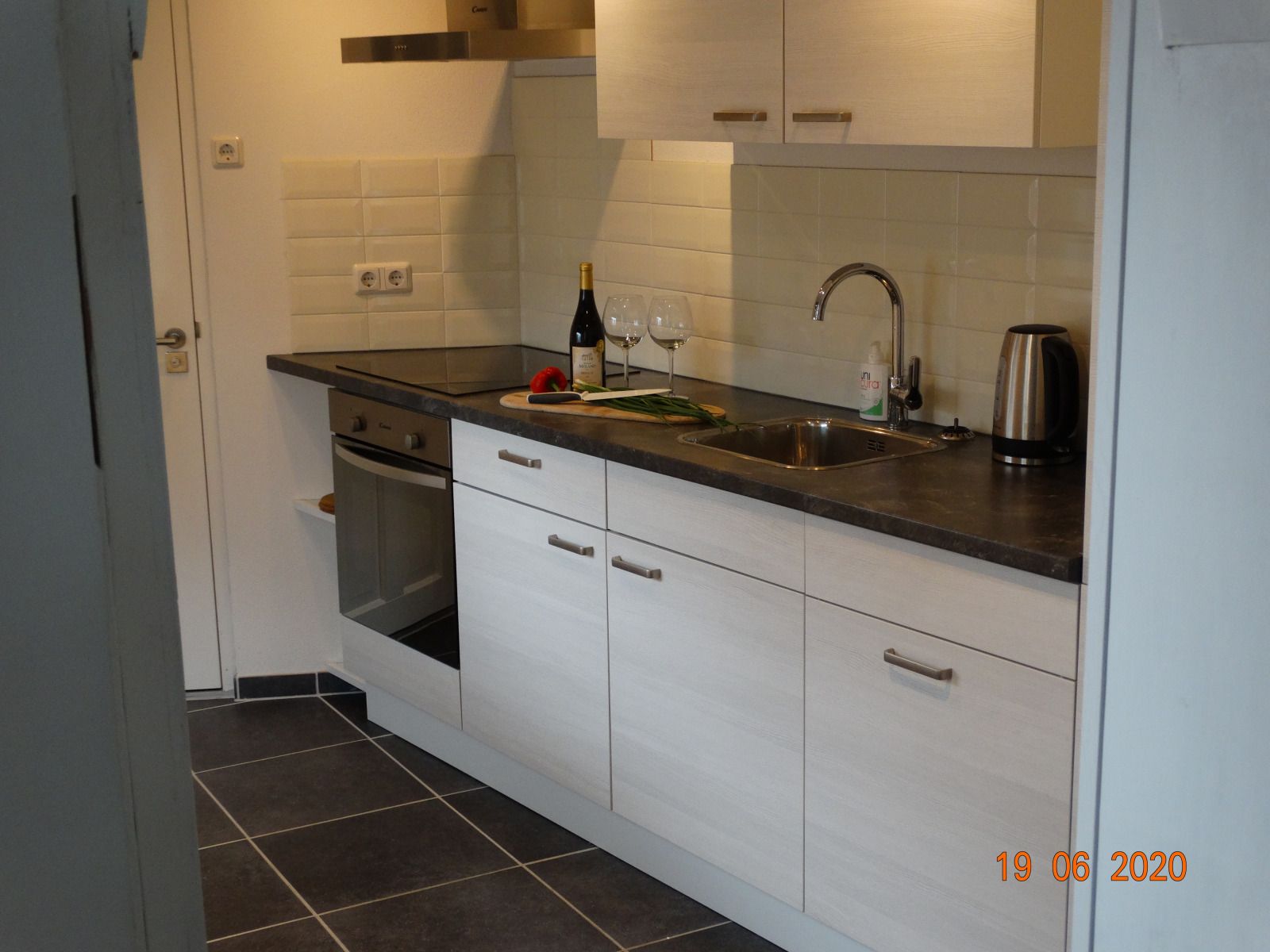 Modern living room with TV in vacation home ZE1542, Biervliet, Zeeland.