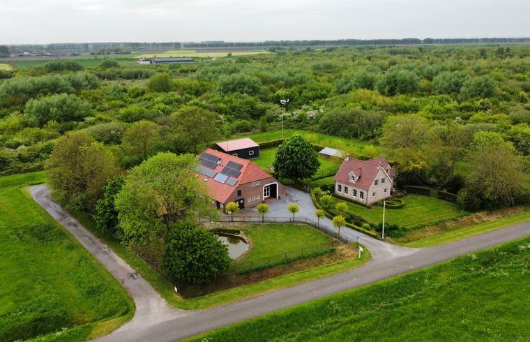 Holiday home in Biervliet, Zeeuws-Vlaanderen, surrounded by lush nature, ideal for a relaxing stay in Zeeland.