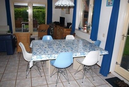 Dining room in Vermare vacation home, Wemeldinge, South Beveland, with spacious table and stylish chairs.