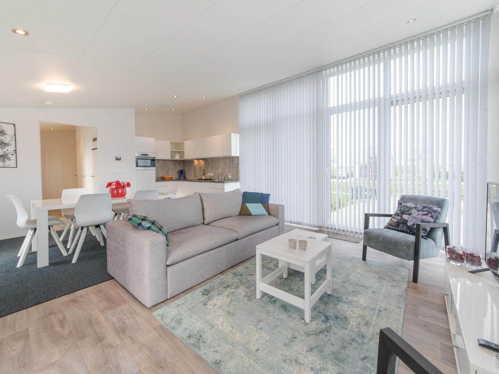 Spacious living room and dining area in Holiday home Waterresort Oosterschelde - house no. 38 in Wemeldinge, South Beveland.