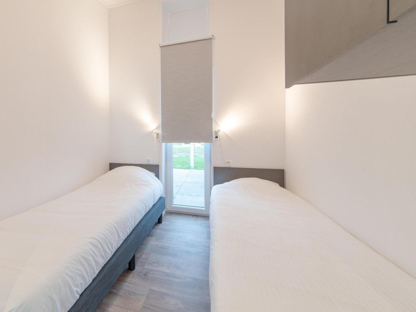 Second bedroom with two single beds in Holiday home Waterresort Oosterschelde - house no. 38 in Wemeldinge.