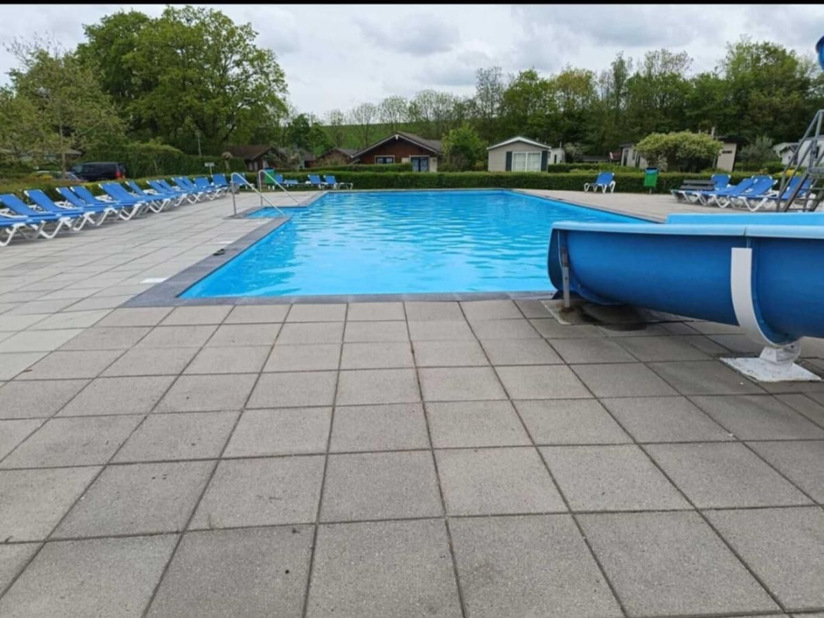 Relax by the refreshing pool of vacation home Scheldeoord 54 in Baarland, South Beveland, ideal for a summer vacation in Zeeland.