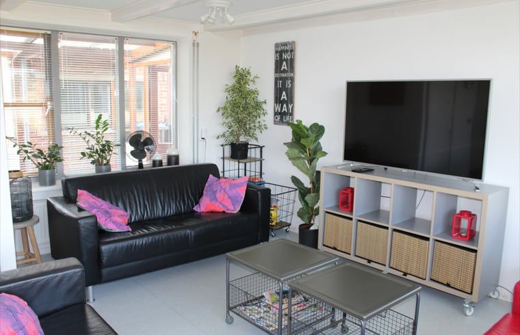 Modern living room of Cottage in Lewedorp with comfortable seating area in South Beveland, Zeeland.
