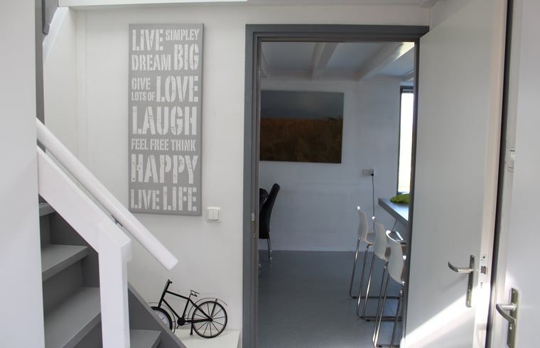 Atmospheric hall of Huisje in Lewedorp, an inviting vacation home in Zeeland.