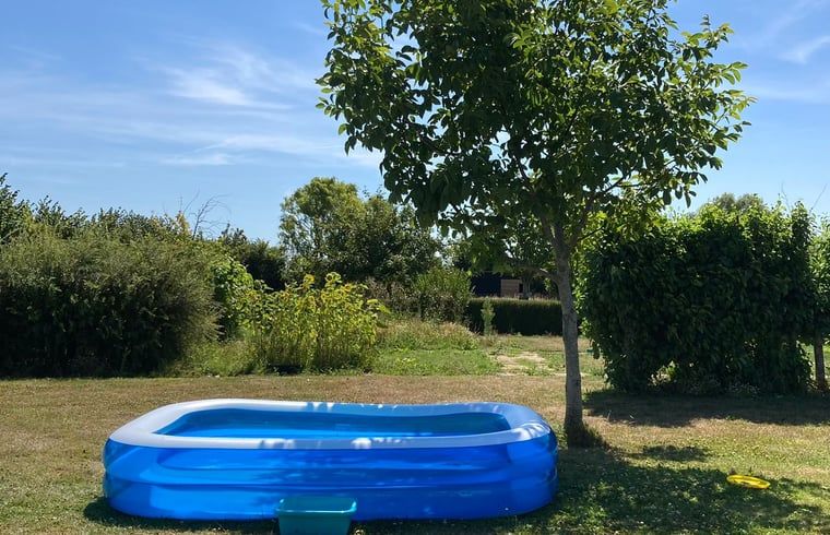 Refreshing swimming pool in the garden of Cottage in Lewedorp, ideal for summer days in Zeeland.