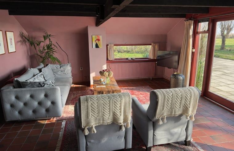Interior space with sitting area in Cottage in Stolwijk, vacation home in Alblasserwaard, South Holland.