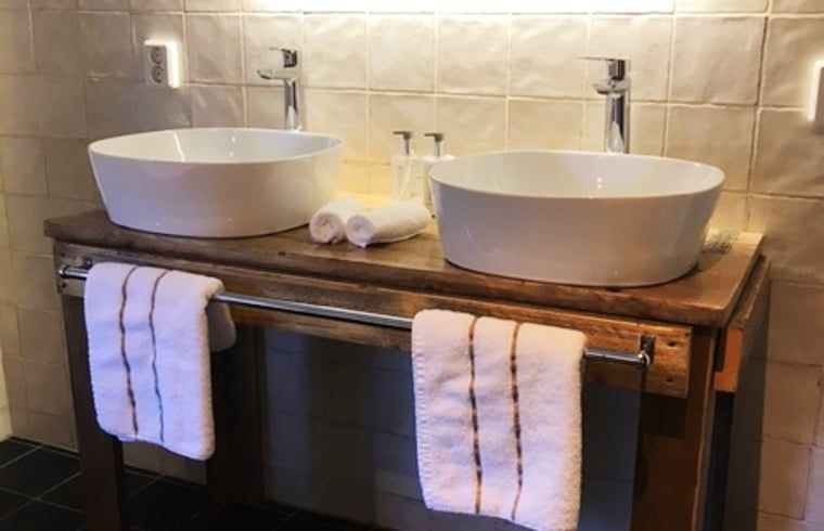 Red door and interior of Cottage in Stolwijk, vacation home in Alblasserwaard, South Holland.