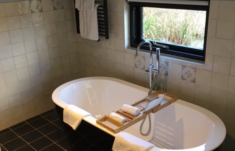 Dining room with atmospheric lighting in Cottage in Stolwijk, vacation accommodation in South Holland.