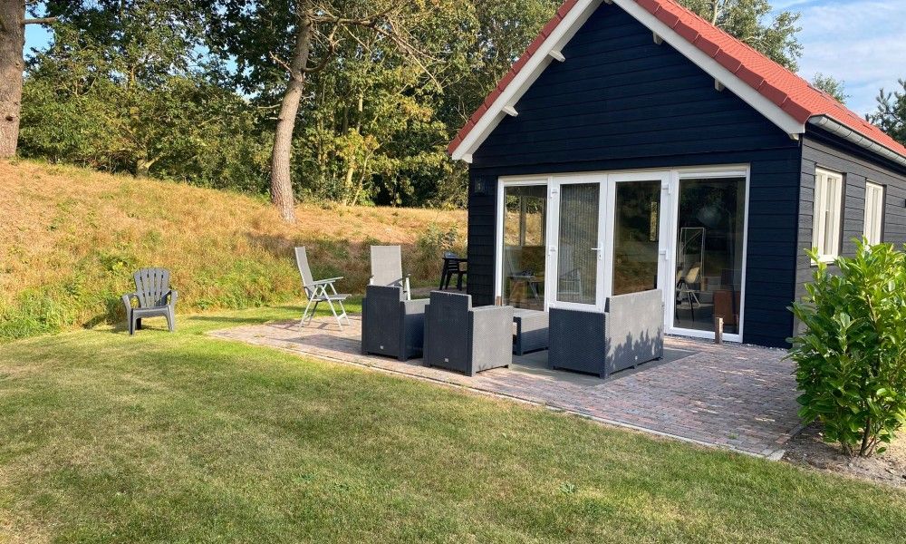 Enjoy the peace and quiet on the terrace of vacation home Vrijheid in Ouddorp, Goeree-Overflakkee, South Holland.