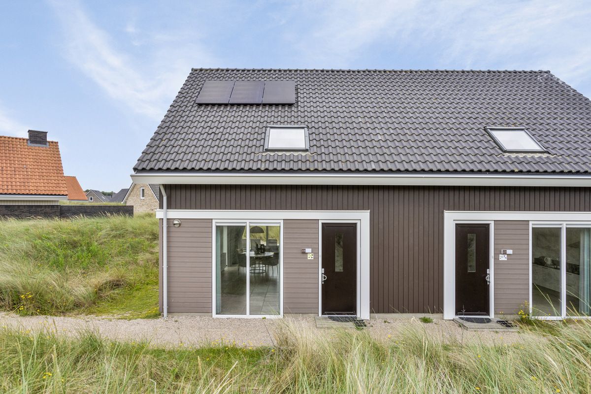 Reihenhaus in Ouddorp, ein Ferienhaus in Goeree-Overflakkee, Sdholland, umgeben von Dnen und Natur.