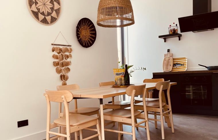 Dining Room in Cottage in Ouddorp, a vacation home in Goeree-Overflakkee, South Holland with stylish decor.