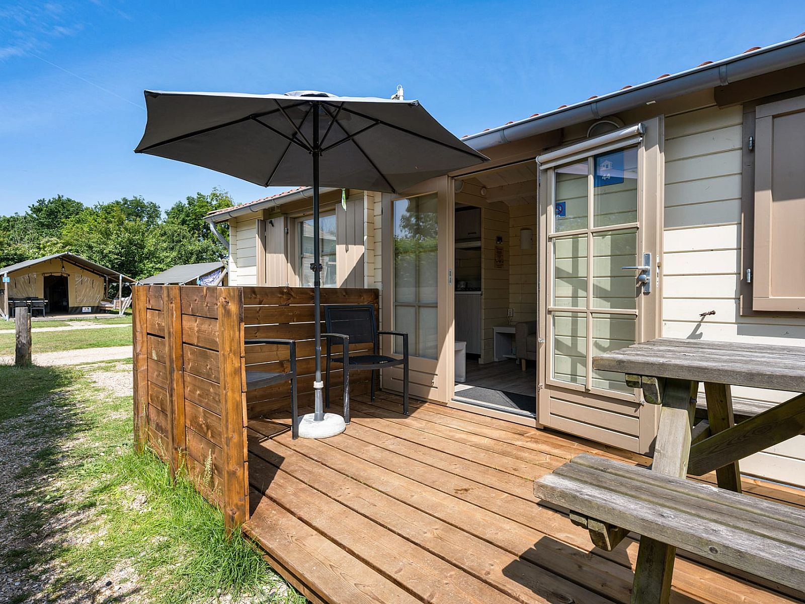 Enjoy the sun on the veranda of Camping Chalet the Albatros Plus in Ouddorp, Goeree-Overflakkee, South Holland.