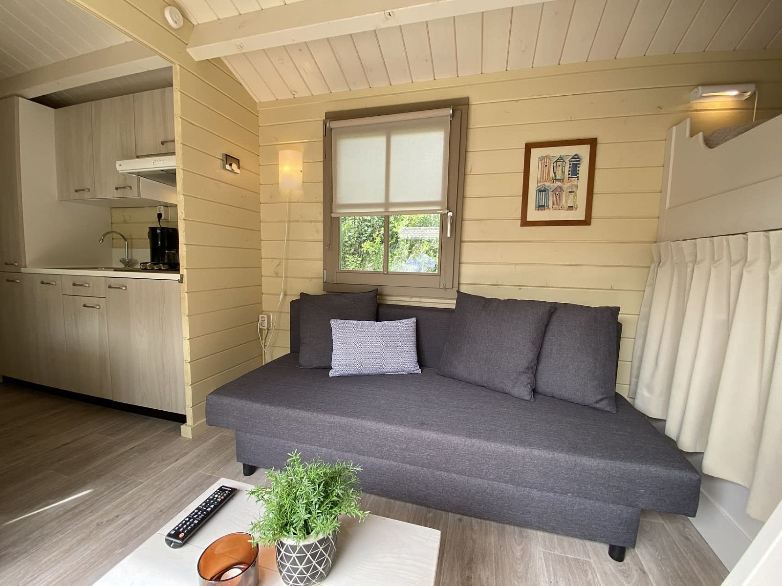 Cozy interior of Camping Chalet the Albatros Plus in Ouddorp, Goeree-Overflakkee, South Holland with comfortable seating area.