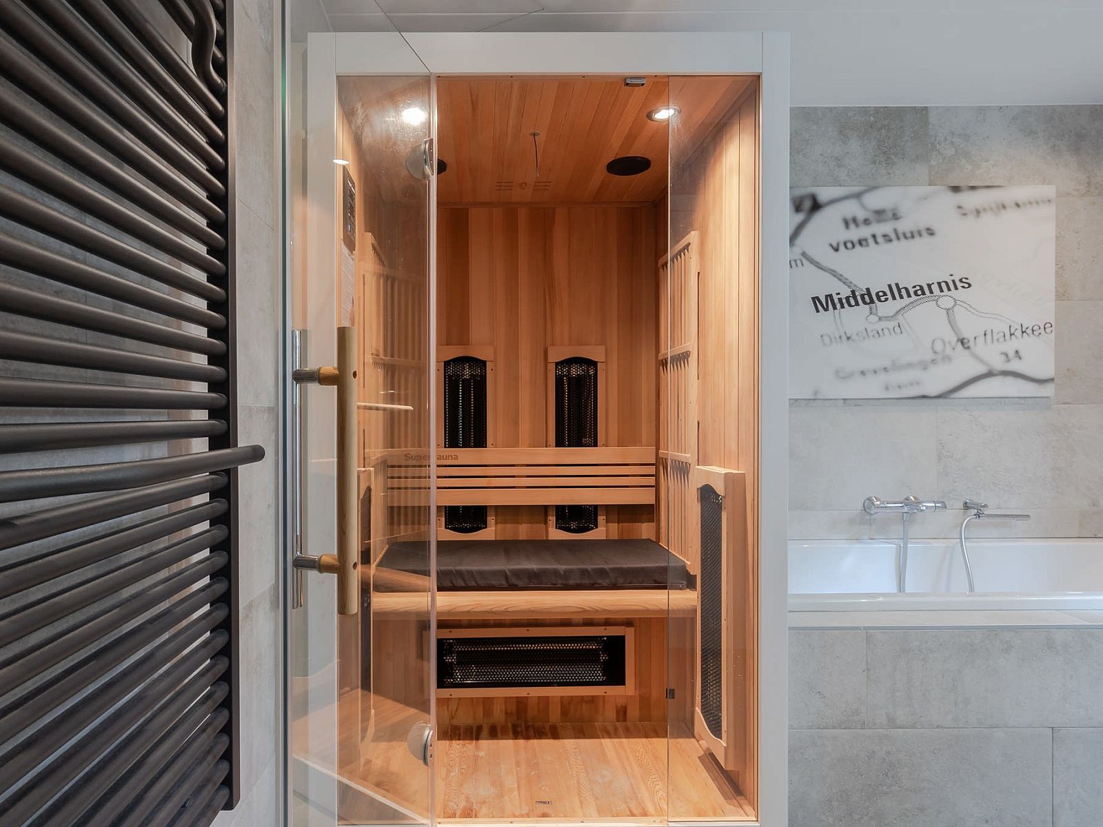 Wellness area in Bungalow Middelharnis, Ouddorp with sauna and stylish bathroom.