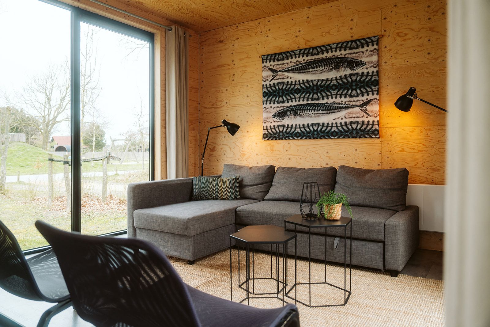 Comfortable sitting area in Duunroos vacation home, Ouddorp, overlooking nature.