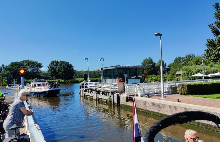 Lock and boats near Holiday cottage in Nieuwveen, South Holland.