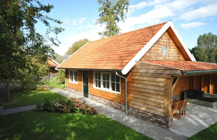 Vacation home in Hazerswoude-Rijndijk, located in the Green Heart of South Holland, with a charming wooden facade and inviting terrace.