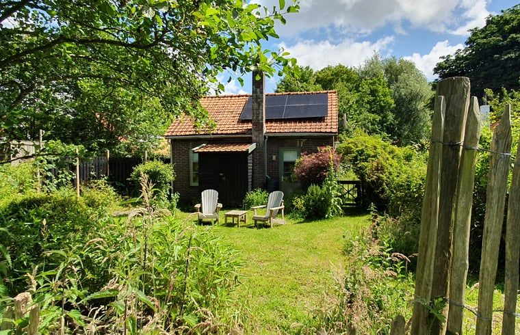 Cozy garden at Holiday home in Oostvoorne, ideal for relaxation in Voorne Putten.
