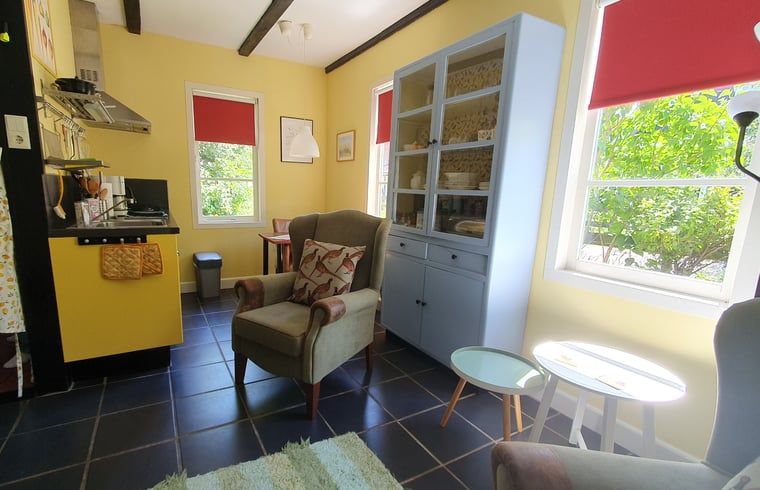 Bright living space in Holiday Home in Oostvoorne, with cozy furnishings and lots of natural light.