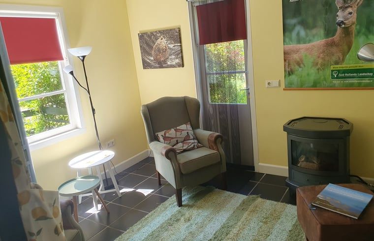 Cozy reading corner in Holiday home in Oostvoorne, ideal for relaxation in South Holland.