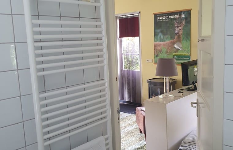 Bathroom with garden view in Holiday home in Oostvoorne, Voorne Putten.
