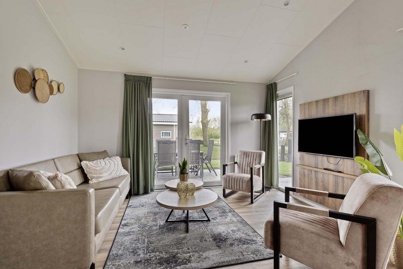 Gezellige zithoek met uitzicht in Leijhoeve 6 personen, vakantiehuis in Rotterdam omstreken.