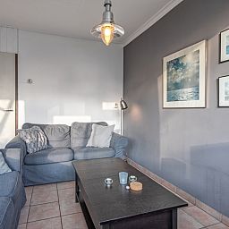 Ontspan in de knusse zithoek van Vakantiehuis Slufterhoek 114, De Cocksdorp, Texel, met stijlvolle decoratie.